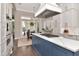 An expansive kitchen featuring a center island with gas range and seating area, perfect for entertaining at 29540 Chapel Park Dr, Wesley Chapel, FL 33543