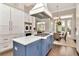A spacious kitchen featuring a center island with gas range and seating area, perfect for entertaining at 29540 Chapel Park Dr, Wesley Chapel, FL 33543
