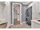 Modern laundry room with a stackable washer and dryer, and view to the stairs at 29540 Chapel Park Dr, Wesley Chapel, FL 33543