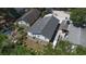 Aerial view of a home with a dark roof and a tidy backyard showcasing the property's dimensions at 3105 Gordon Ct, Tampa, FL 33619