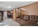 Spacious basement area with comfortable seating and a potential recording studio with modern flooring at 3105 Gordon Ct, Tampa, FL 33619