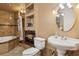 Well-lit bathroom with a shower and a large sink and toilet at 3105 Gordon Ct, Tampa, FL 33619