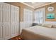 Bedroom with multiple closets, wood floors, and a light color scheme at 3105 Gordon Ct, Tampa, FL 33619