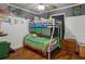 This bedroom features a unique bunkbed and hardwood floors at 3105 Gordon Ct, Tampa, FL 33619