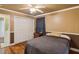 This bedroom features a ceiling fan and an attached bathroom at 3105 Gordon Ct, Tampa, FL 33619
