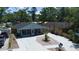 Charming home featuring a screened-in porch, large front yard and mature trees at 3105 Gordon Ct, Tampa, FL 33619