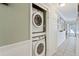Conveniently located, this laundry area includes a stacked washer and dryer at 3105 Gordon Ct, Tampa, FL 33619