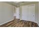 Bedroom with beautiful wood floors, a closet, and white trim at 324 3Rd N Ave, Safety Harbor, FL 34695