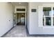 Elegant entryway with double doors and stone-paved flooring, leading to a well-lit interior at 324 3Rd N Ave, Safety Harbor, FL 34695