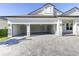 Spacious three-car garage with open doors and a well-paved driveway for easy access at 324 3Rd N Ave, Safety Harbor, FL 34695