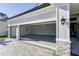 Spacious two-car garage with epoxy flooring, stylish lighting, and ample space at 324 3Rd N Ave, Safety Harbor, FL 34695