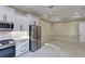 Modern kitchen features stainless steel appliances, custom cabinets, and tile backsplash at 324 3Rd N Ave, Safety Harbor, FL 34695