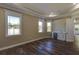 Large living room with hardwood floors, built-in sink and cabinets, and plenty of natural light at 324 3Rd N Ave, Safety Harbor, FL 34695