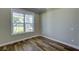 Well-lit office with hardwood floors, a large window, and neutral wall color at 324 3Rd N Ave, Safety Harbor, FL 34695