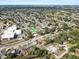 Aerial view of home situated in a lush community, close to school, presenting a blend of comfort and convenience at 3404 33Rd Street W Ct, Bradenton, FL 34205