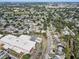 Expansive aerial view of the neighborhood, showcasing mature trees, and proximity to schools at 3404 33Rd Street W Ct, Bradenton, FL 34205
