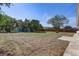 Large backyard with a partial fence and mature trees at 3404 33Rd Street W Ct, Bradenton, FL 34205