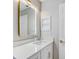 Bathroom vanity featuring white counters, gold hardware and lighting and modern faucet at 3404 33Rd Street W Ct, Bradenton, FL 34205