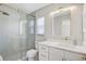 Bathroom featuring a modern shower with glass doors and a vanity with gold hardware at 3404 33Rd Street W Ct, Bradenton, FL 34205