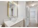 Updated bathroom with a modern vanity, sleek gold hardware, and stylish, lighted mirror at 3404 33Rd Street W Ct, Bradenton, FL 34205
