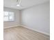 Bright bedroom features sleek laminate flooring and a large window at 3404 33Rd Street W Ct, Bradenton, FL 34205