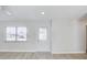 Bright entryway featuring laminate flooring, a new front door, and a large window for natural light at 3404 33Rd Street W Ct, Bradenton, FL 34205