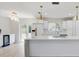 Modern kitchen featuring white cabinets, gold hardware, a breakfast bar, and stainless steel appliances at 3404 33Rd Street W Ct, Bradenton, FL 34205
