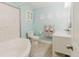 Bright bathroom features a soaking tub, white vanity, and marine-inspired decorative elements at 3675 41St S Way # K, St Petersburg, FL 33711