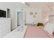 Serene bedroom offering a queen bed, stylish furnishings, and calming pastel décor at 3675 41St S Way # K, St Petersburg, FL 33711
