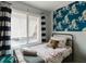 Inviting bedroom with natural light, modern window treatments and fun octopus themed decor at 3675 41St S Way # K, St Petersburg, FL 33711