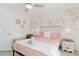 Inviting bedroom featuring queen bed, soft lighting, and elegant botanical wallpaper at 3675 41St S Way # K, St Petersburg, FL 33711