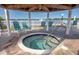 Relaxing hot tub under a gazebo with comfortable seating overlooking the water at 3675 41St S Way # K, St Petersburg, FL 33711