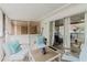 Inviting screened-in patio featuring cozy seating and sliding door access to the house at 3675 41St S Way # K, St Petersburg, FL 33711