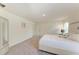 Cozy bedroom featuring neutral walls, plush carpet, a queen bed and a wardrobe cabinet at 3879 E Price Blvd, North Port, FL 34288