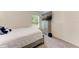 Bedroom includes desk, TV and modern grey furniture at 3879 E Price Blvd, North Port, FL 34288