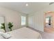 Bright bedroom features neutral tones, a closet, and a window for natural light at 3879 E Price Blvd, North Port, FL 34288