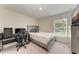 Bedroom includes desk, TV and modern grey furniture at 3879 E Price Blvd, North Port, FL 34288