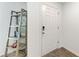Clean and modern entryway with wood-look tile and a stylish shelving unit at 3879 E Price Blvd, North Port, FL 34288