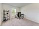 Bright home office space featuring a modern desk, rolling chair, and minimalist decor at 3879 E Price Blvd, North Port, FL 34288