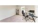 Bright home office space featuring a modern desk, rolling chair, and minimalist decor with motivational quote wall decor at 3879 E Price Blvd, North Port, FL 34288