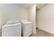 A modern laundry room with a washer and dryer set at 3879 E Price Blvd, North Port, FL 34288