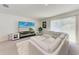 Comfortable living room featuring a modern entertainment center and sectional sofa at 3879 E Price Blvd, North Port, FL 34288
