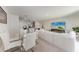 Open concept living space with dining room, kitchen with seating and living room with large television at 3879 E Price Blvd, North Port, FL 34288