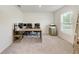 Bright and airy office space featuring neutral carpet and a large window at 3879 E Price Blvd, North Port, FL 34288