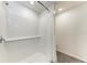 A walk-in shower features white subway tile, a built-in shelf, and modern fixtures with a shower curtain at 3879 E Price Blvd, North Port, FL 34288