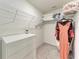 Organized walk-in closet with white dresser, wire shelving, and hanging clothes at 3879 E Price Blvd, North Port, FL 34288