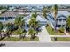 An elevated view of a blue home with manicured lawn and proximity to surrounding neighborhood at 426 Islebay Dr, Apollo Beach, FL 33572