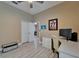 Bedroom featuring a ceiling fan, a desk and closet for storage, and wood-look floors at 426 Islebay Dr, Apollo Beach, FL 33572