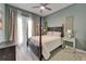 Bedroom with bed, curtains, and view to the outside at 426 Islebay Dr, Apollo Beach, FL 33572
