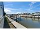 Canal view with several homes that have boat docks and lifts at 426 Islebay Dr, Apollo Beach, FL 33572
